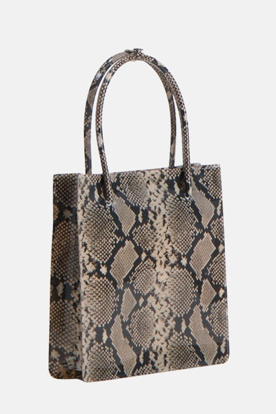 Sac à main beige à motif serpent de MANGO, avec deux anses et une forme rectangulaire.
