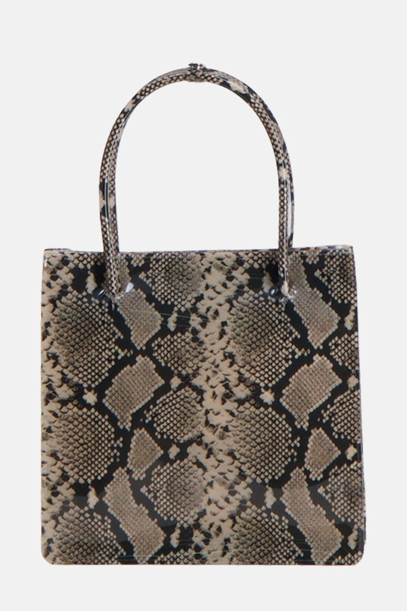 Sac à main beige de MANGO à motif serpent, avec une anse arrondie et une forme rectangulaire.