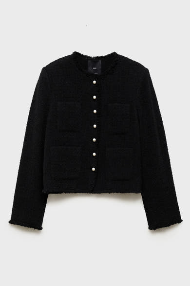 Zwarte tweed gilet van MANGO, met opgestikte zakken en parelmoeren knopen.