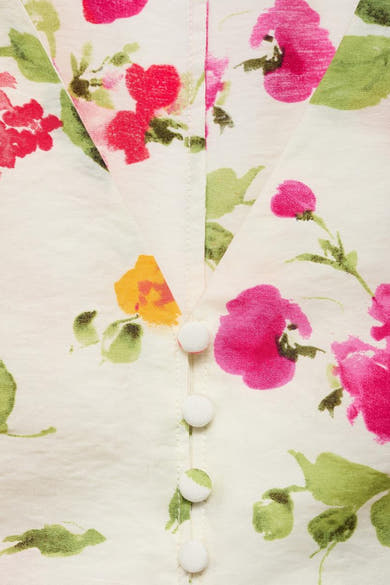 Blouse multicolore de MANGO, à motif floral, détail de boutons et col en V.
