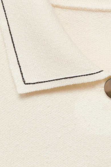 Ecru gilet van MANGO, met donkere bies en decoratieve knoop.