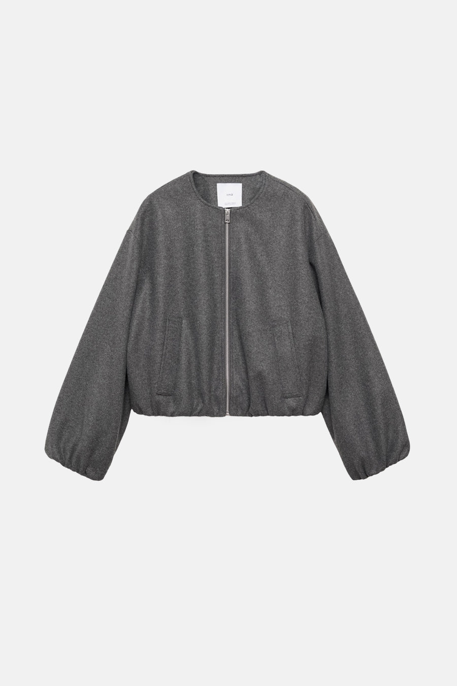 Blouson gris de MANGO avec manches bouffantes et fermeture éclair argentée.