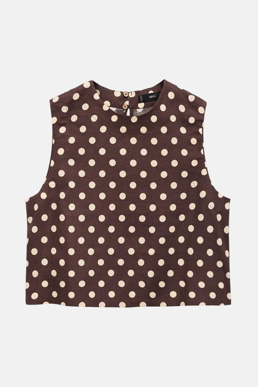 Blouse sans manches marron by MANGO, à pois blancs sur fond uni, avec fermeture au dos.
