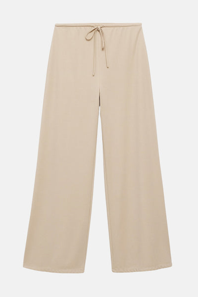 Pantalon beige de MANGO, coupe large avec taille élastique et cordon de serrage.
