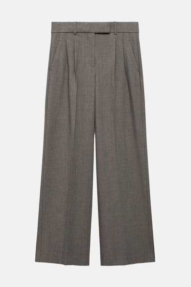 Bruine kostuumbroek van MANGO, wijde pasvorm met plooien aan de taille en zijzakken.