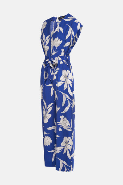 Blauwe jumpsuit met bloemenprint van MANGO, met een strikceintuur in de taille en een losse pasvorm.