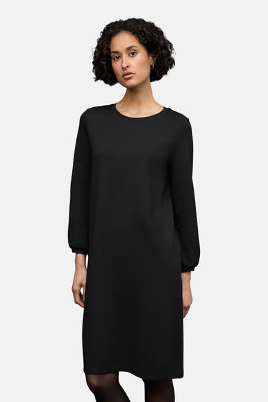 Robe noire par STREET ONE avec manches longues et collants opaques.
