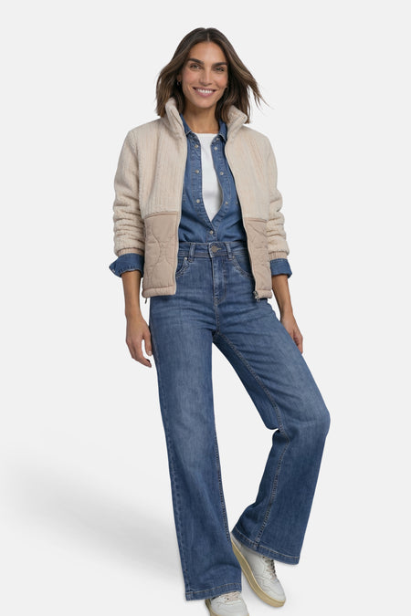 Beige shearling and quilted casual jacket by STREET ONE, worn over denim shirt with wide-leg jeans and white sneakers, full-body lifestyle view
