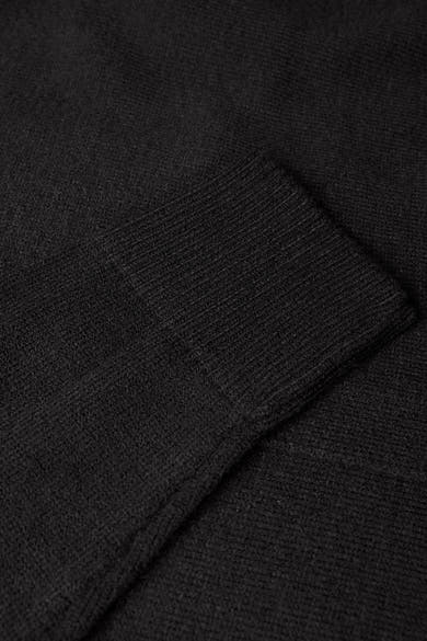 Gilet noir de STREET ONE, texture tricotée fine avec bordure côtelée au poignet.
