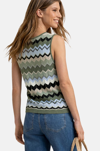Multicolored zigzag knit tank top by STREET ONE, side view showing olive, blue, and black pattern, worn with jeans.