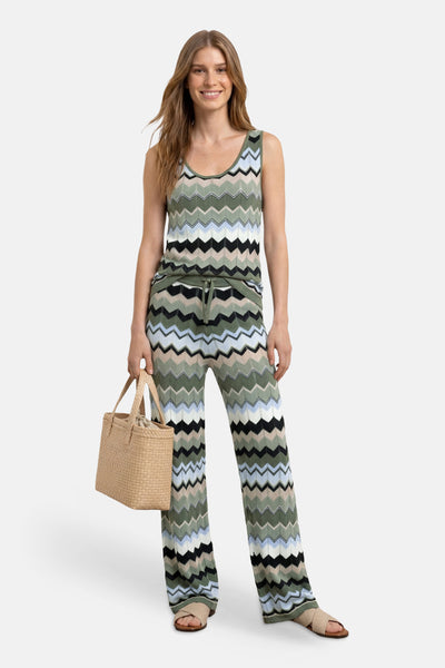 Multicolored zigzag-patterned sleeveless top by STREET ONE, worn with matching wide-leg pants, beige woven bag, and sandals in full-body lifestyle view
