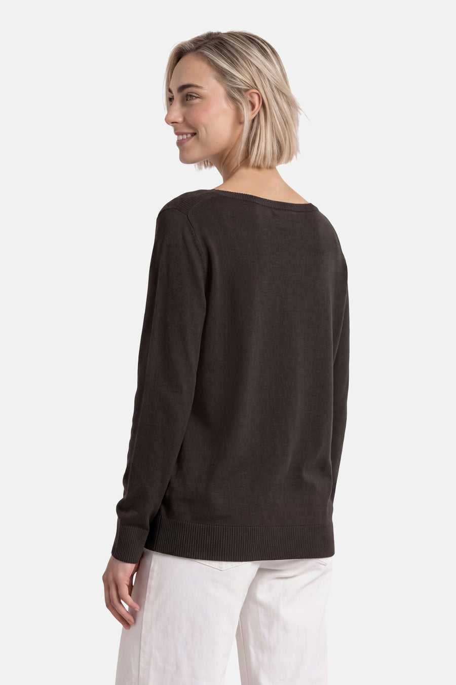 Brown round-neck sweater by STREET ONE, shown from side view with ribbed cuffs and hem, worn with white pants.