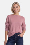 Rose pink ribbed knit crewneck sweater by STREET ONE, worn with dark blue jeans, front view, model smiling.