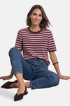 Brown and pink striped short-sleeve crewneck sweater by STREET ONE, worn with blue jeans and brown mules, front view.