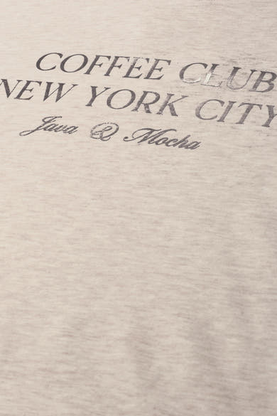 Beige O-neck sweatshirt with vintage-style "Coffee Club New York City" text print, soft heathered texture, close-up view