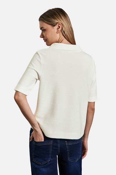 Ecru polo van STREET ONE, gedragen met een donkerblauwe jeans, achterzicht.