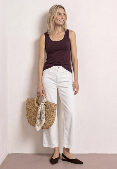 Burgundy sleeveless top by STREET ONE, worn with white wide-leg pants and brown loafers, full-body lifestyle view