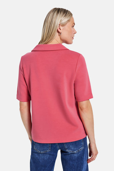 Top met korte mouwen koraal van Street One, gedragen met een blauwe jeans, achterzicht.