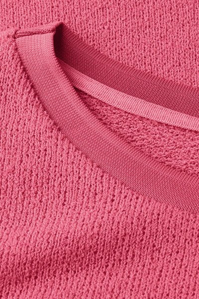 Ronde hals trui van Street One in koraalkleur met textuurbreisel en geribbelde halsdetail.