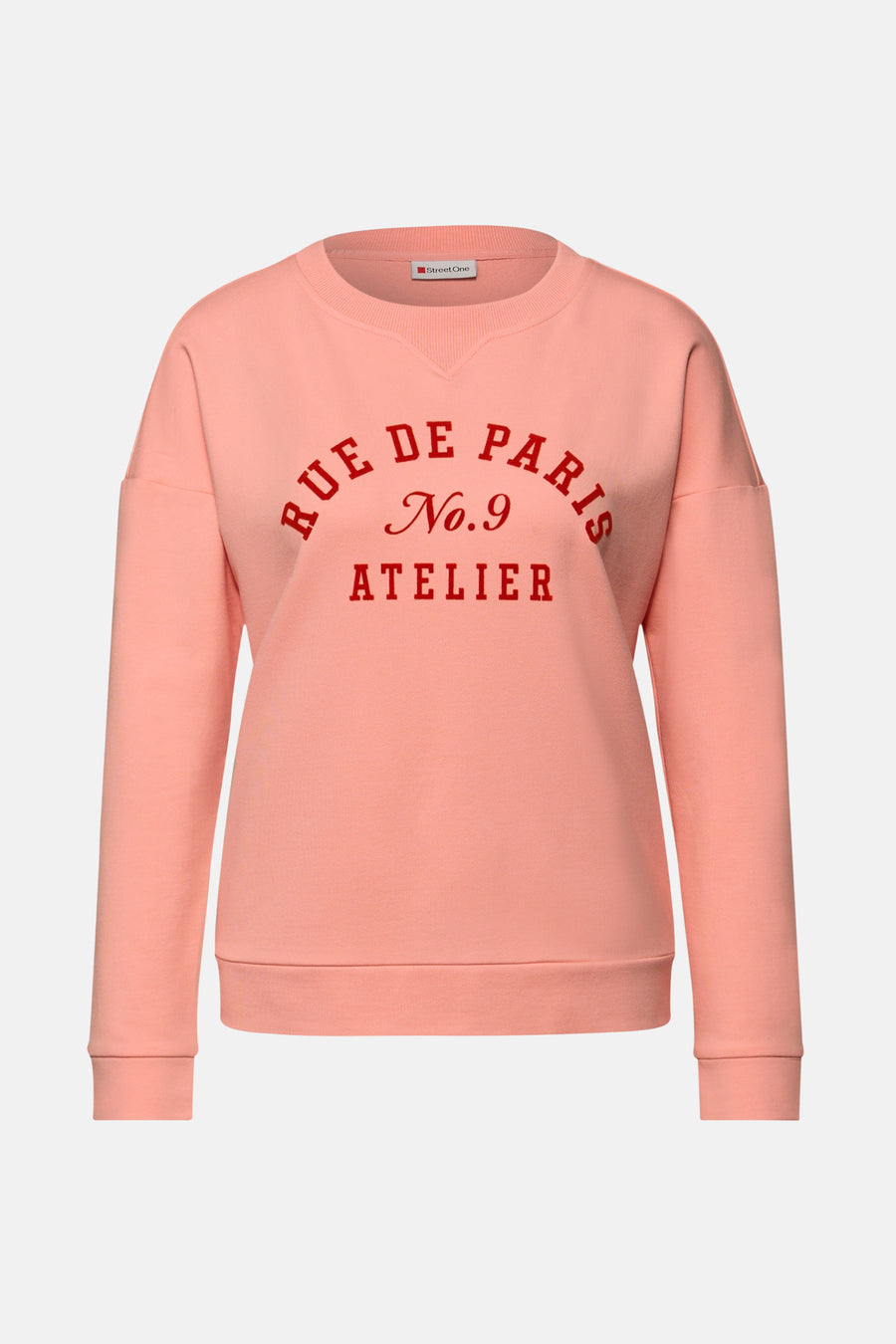 Sweat col rond corail de Street One, imprimé avec texte rouge "Rue de Paris".
