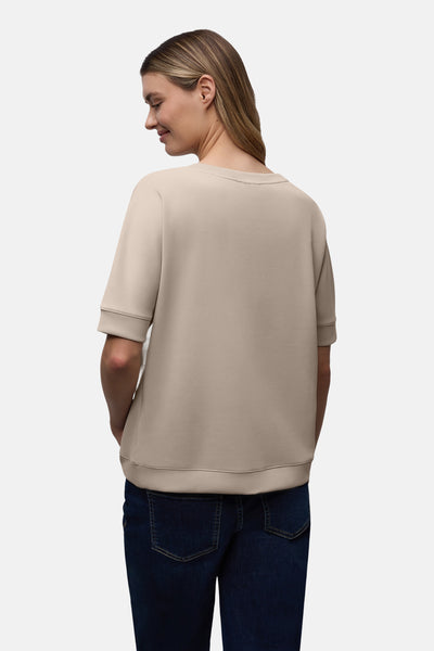 T-shirt beige à manches courtes de STREET ONE, porté avec un jean bleu foncé, vue de dos.