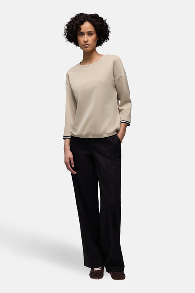 Sweat-shirt beige col rond de Street One, avec manches trois-quarts à rayures et pantalon rayé noir.
