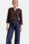 Red 3/4 sleeve blouse with white grid pattern, side tie detail, worn with dark blue jeans, front view
