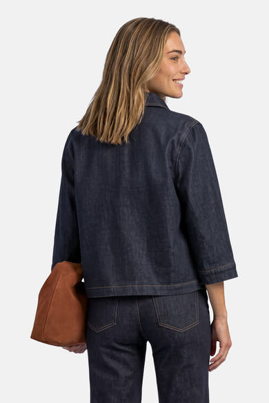 Dark blue denim long-sleeve shirt by STREET ONE, back view with rolled cuffs and brown tote bag.