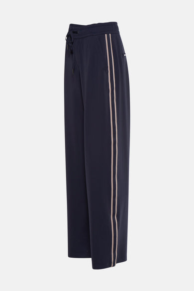 Pantalon bleu de STREET ONE, coupe ample avec rayures contrastantes sur les côtés et cordon de serrage à la taille.