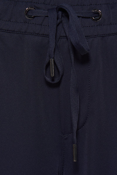 Pantalon bleu de STREET ONE avec cordon de serrage et détails métalliques aux extrémités.