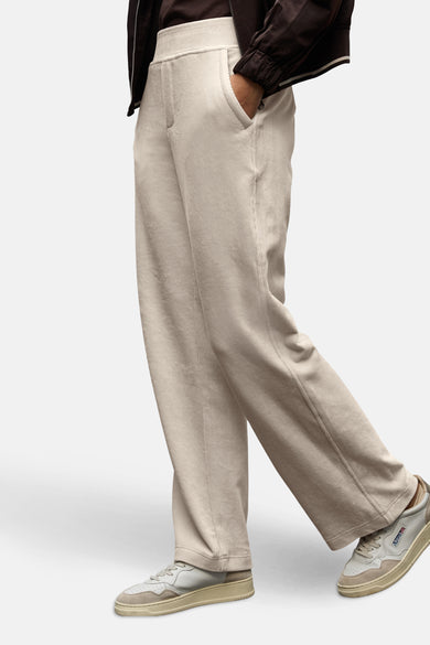 Ecru corduroy trousers by Street One, with a person wearing a brown jacket and beige sneakers.