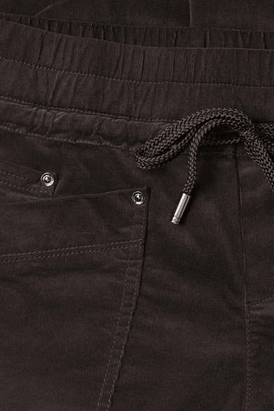Brown corduroy pants by STREET ONE with elastic waist, braided drawstring, and silver-toned metal eyelets, close-up front view