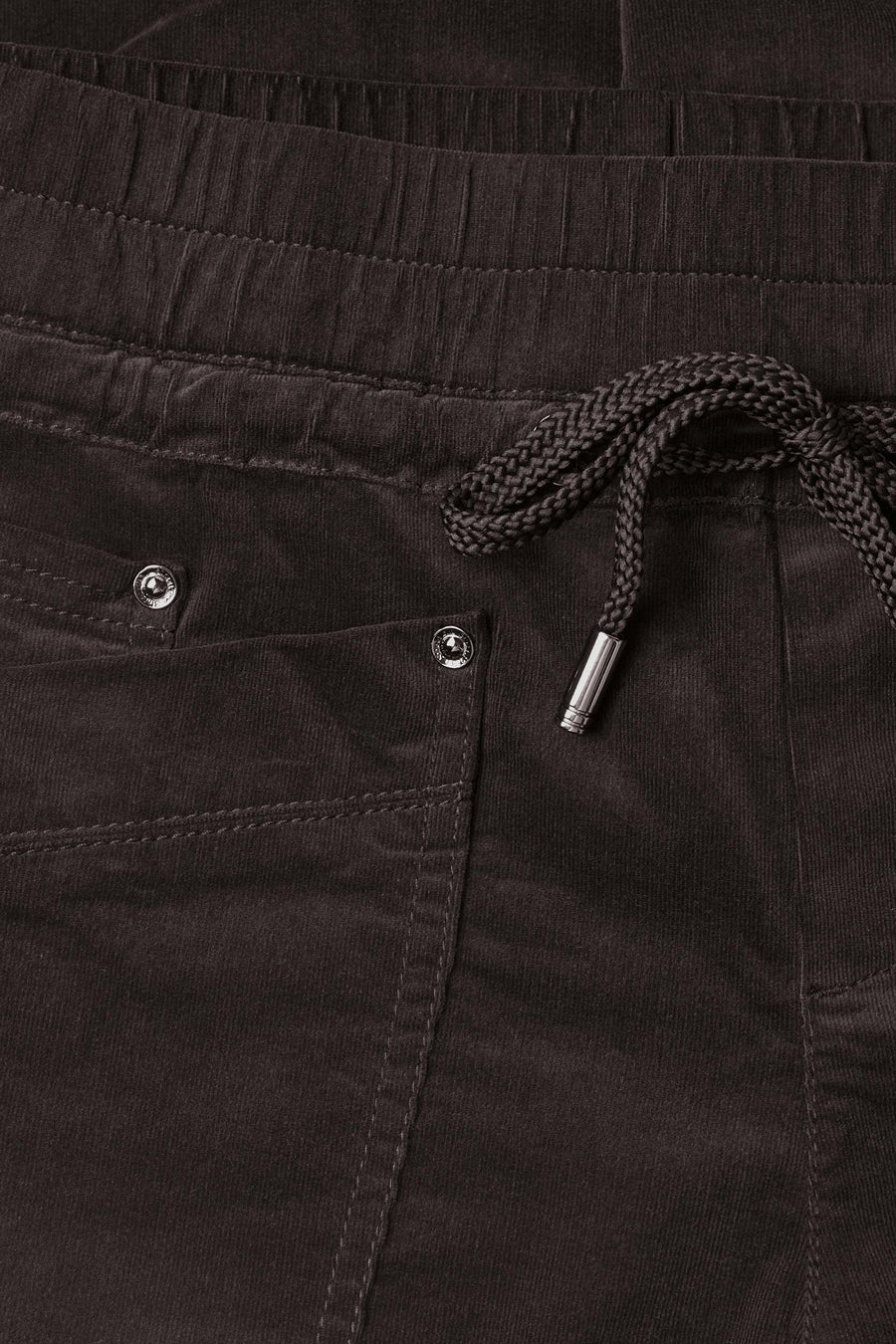 Brown corduroy pants by STREET ONE with elastic waist, braided drawstring, and silver-toned metal eyelets, close-up front view