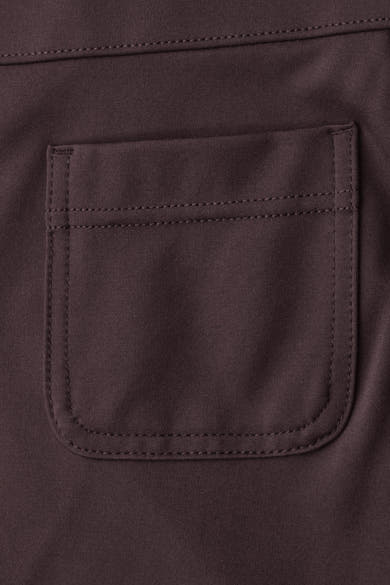 Dark red suit pant by STREET ONE, close-up of back pocket with neat stitching and textured fabric.