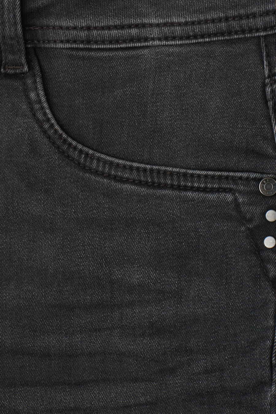 Black bootcut denim jeans by STREET ONE, close-up back pocket with silver buttons and textured fabric detail