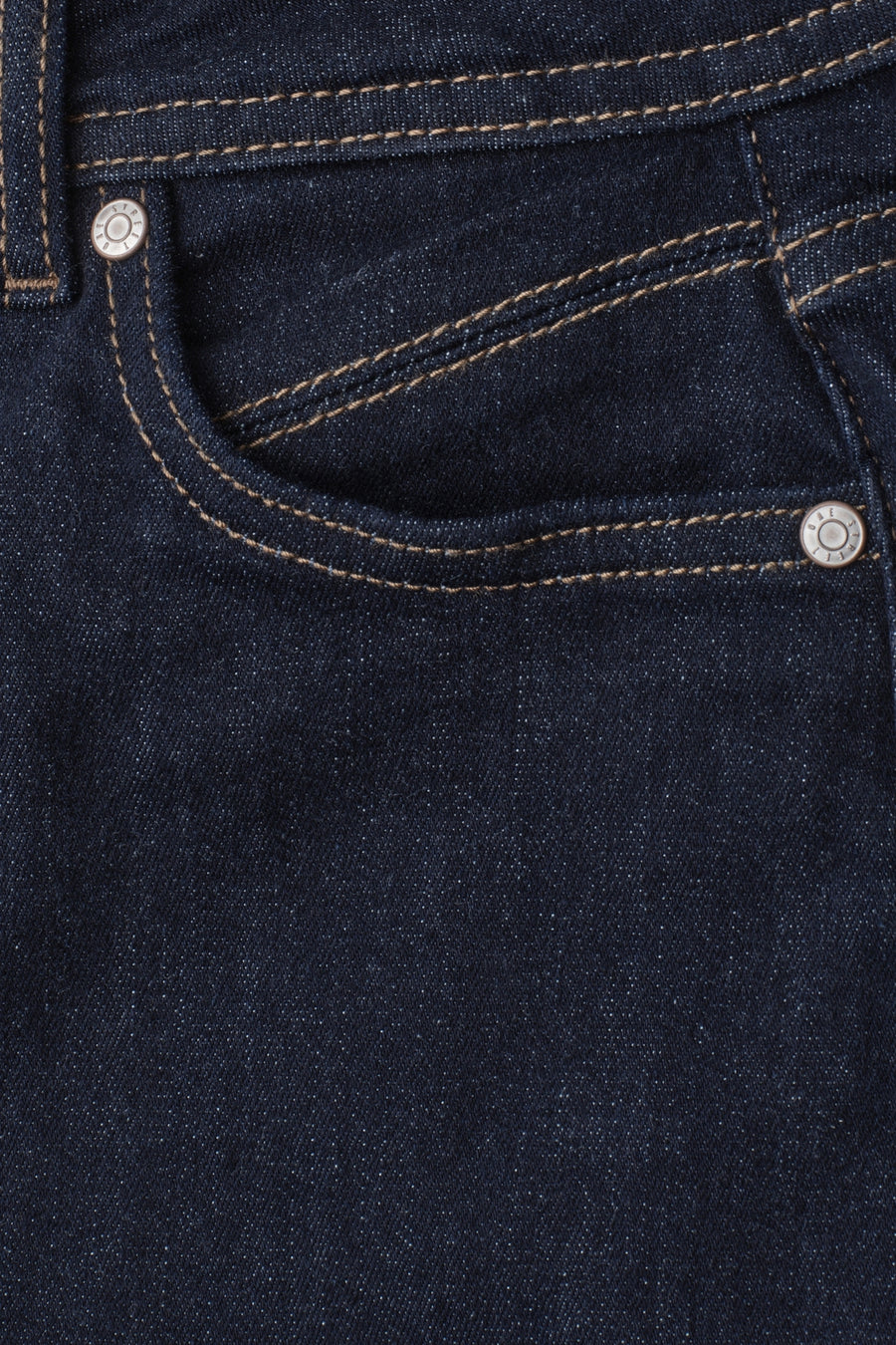 Dark blue denim jeans by STREET ONE, featuring contrast stitching and silver rivets, close-up back pocket view