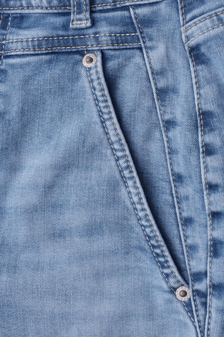 Light blue denim jeans by STREET ONE, featuring faded wash, visible stitching, and silver buttons, close-up front view