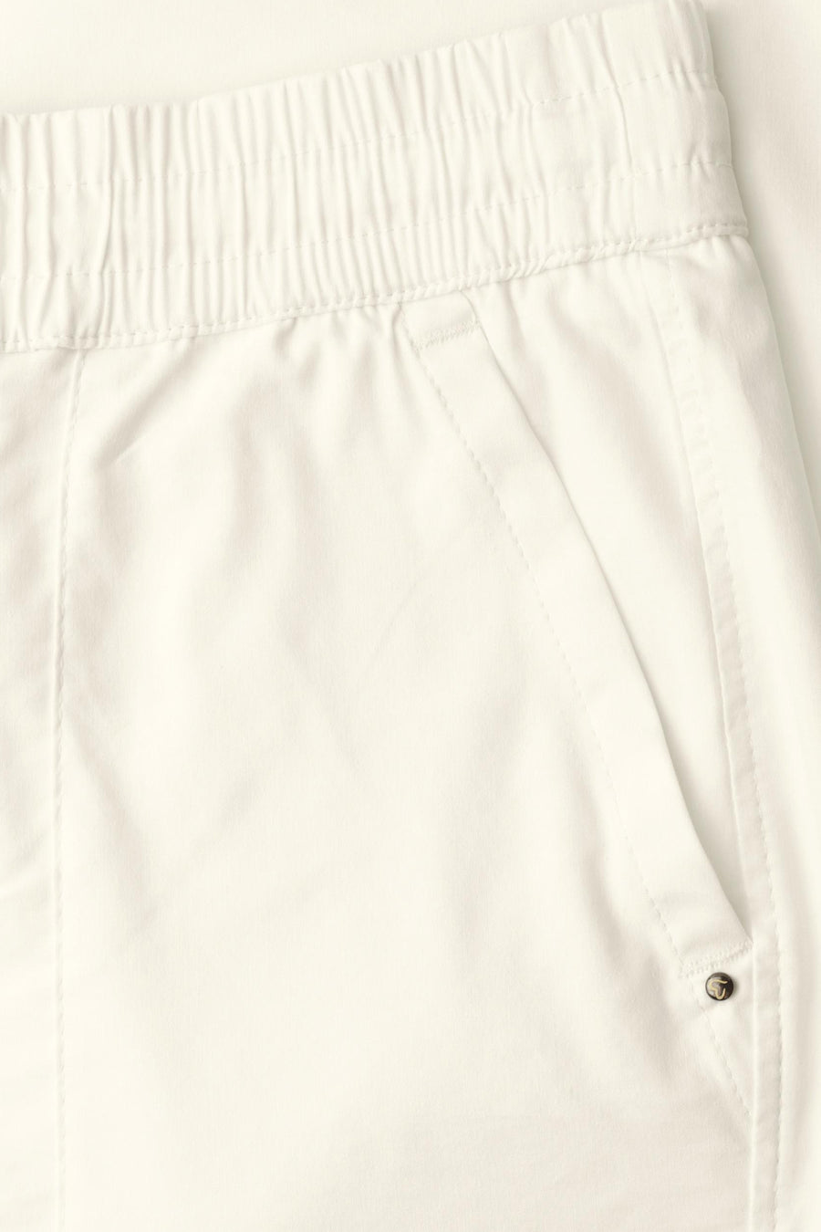 White elastic-waist women's seasonal pants by STREET ONE, featuring clean stitching and a side pocket with button detail, close-up view