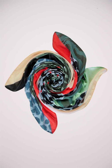 Blue camouflage patterned scarf by STREET ONE, spiraled display with red, green, and beige accents, smooth fabric texture
