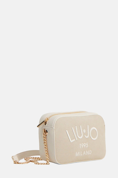 Sac à bandoulière beige de LIU JO avec bandoulière chaîne dorée et logo imprimé.