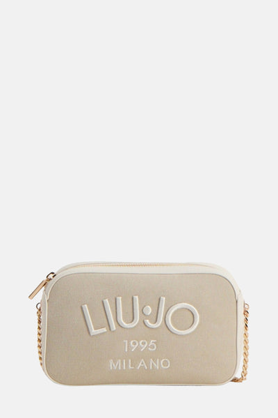 Sac à bandoulière beige de LIU JO, avec une bandoulière chaîne dorée et lettrage en relief.