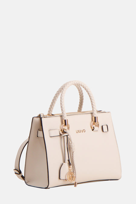 Sac à main écru de LIU JO avec des poignées tressées et un logo doré.
