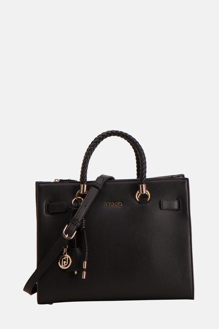 Sac à main noir en cuir de Liu Jo, avec bandoulière, poignée tressée et breloque dorée.