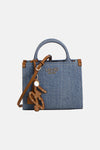 Blauwe denim handtas van LIU JO, met bruine leren afwerkingen en contrasterende stiksels.