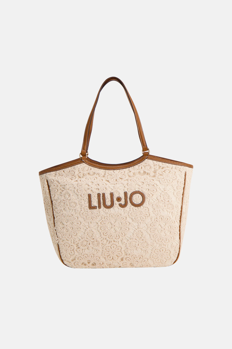 Sac à bandoulière écru de LIU JO, avec un motif en dentelle florale et des finitions marron.