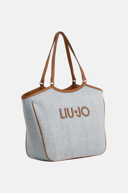 Blauwe schoudertas van denim van LIU JO, met bruine afwerkingen en logo.