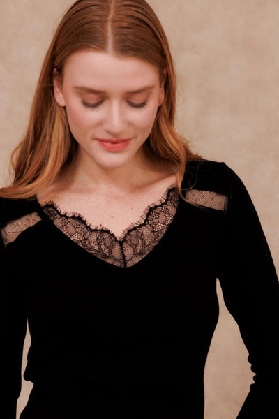 Black long-sleeve T-shirt with lace V-neck and mesh shoulder details, cropped front view