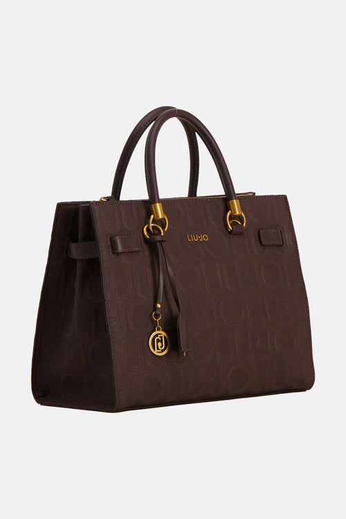 Brown leather handbag with embossed pattern by Liu Jo, featuring gold-tone hardware and front charm, shown in front view.