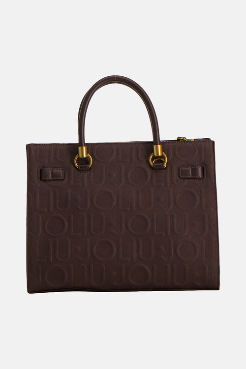 Brown leather handbag with embossed monogram pattern and gold-tone hardware, front view
