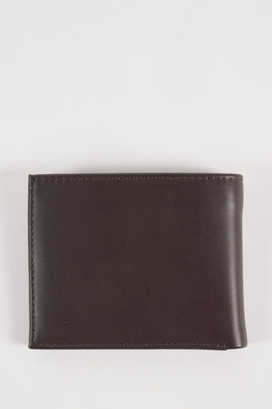 Portefeuille brun de Tommy Jeans avec coutures apparentes sur fond blanc.
